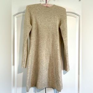 Cream colored women’s wool sweater dress
